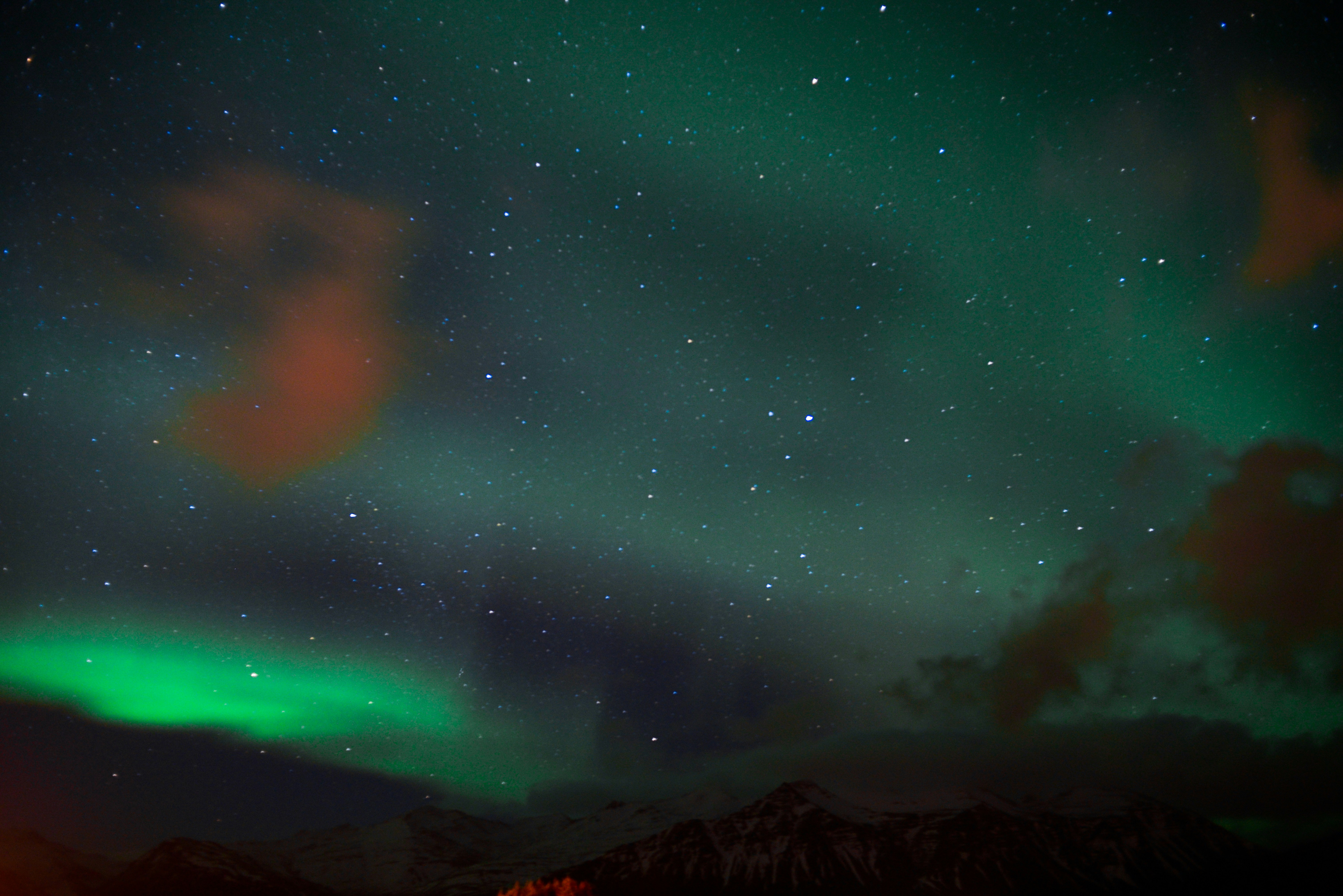 Northern Lights Over Snowy Mountains
