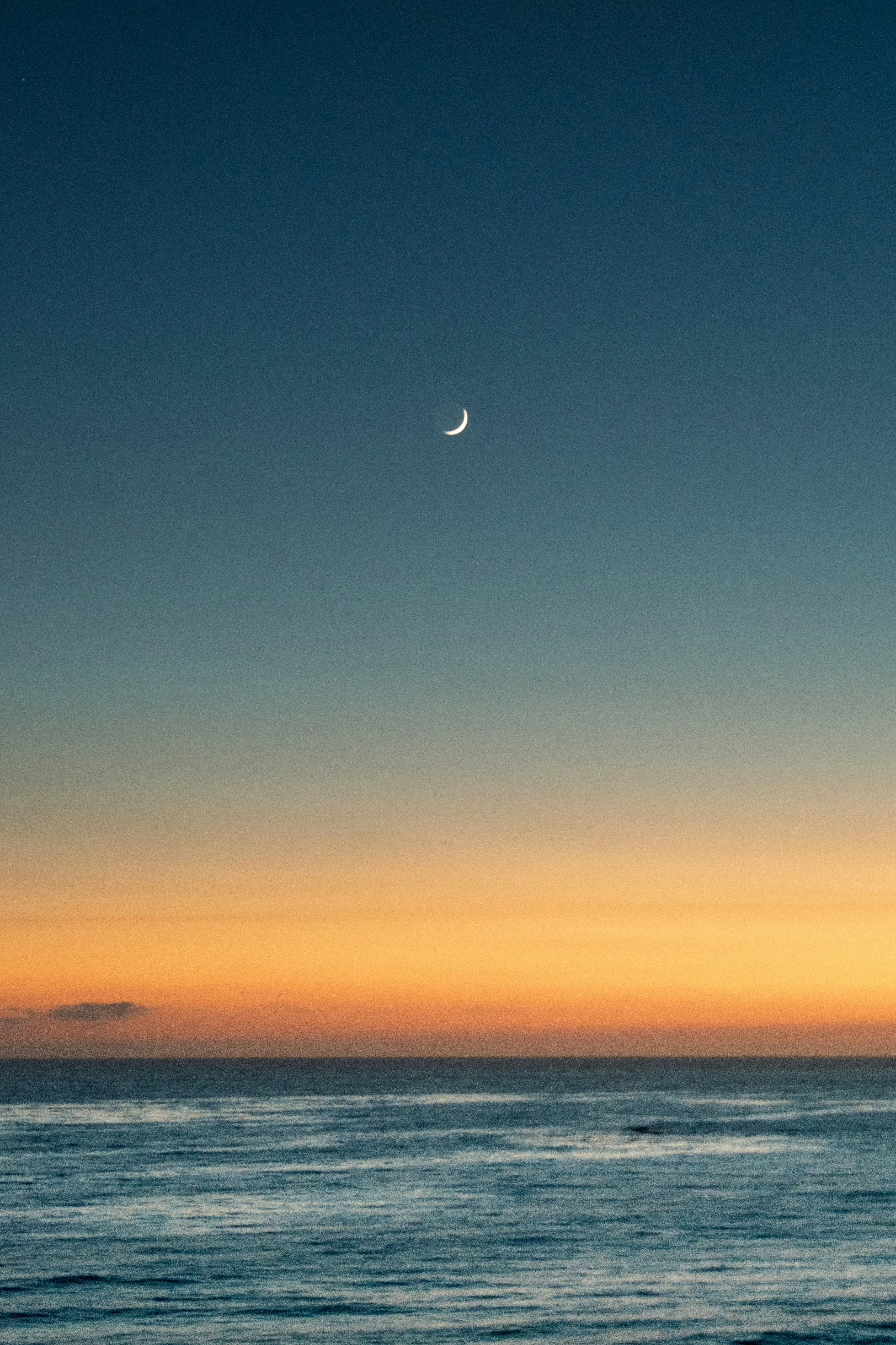 Crescent Moon Over Ocean After Sunset