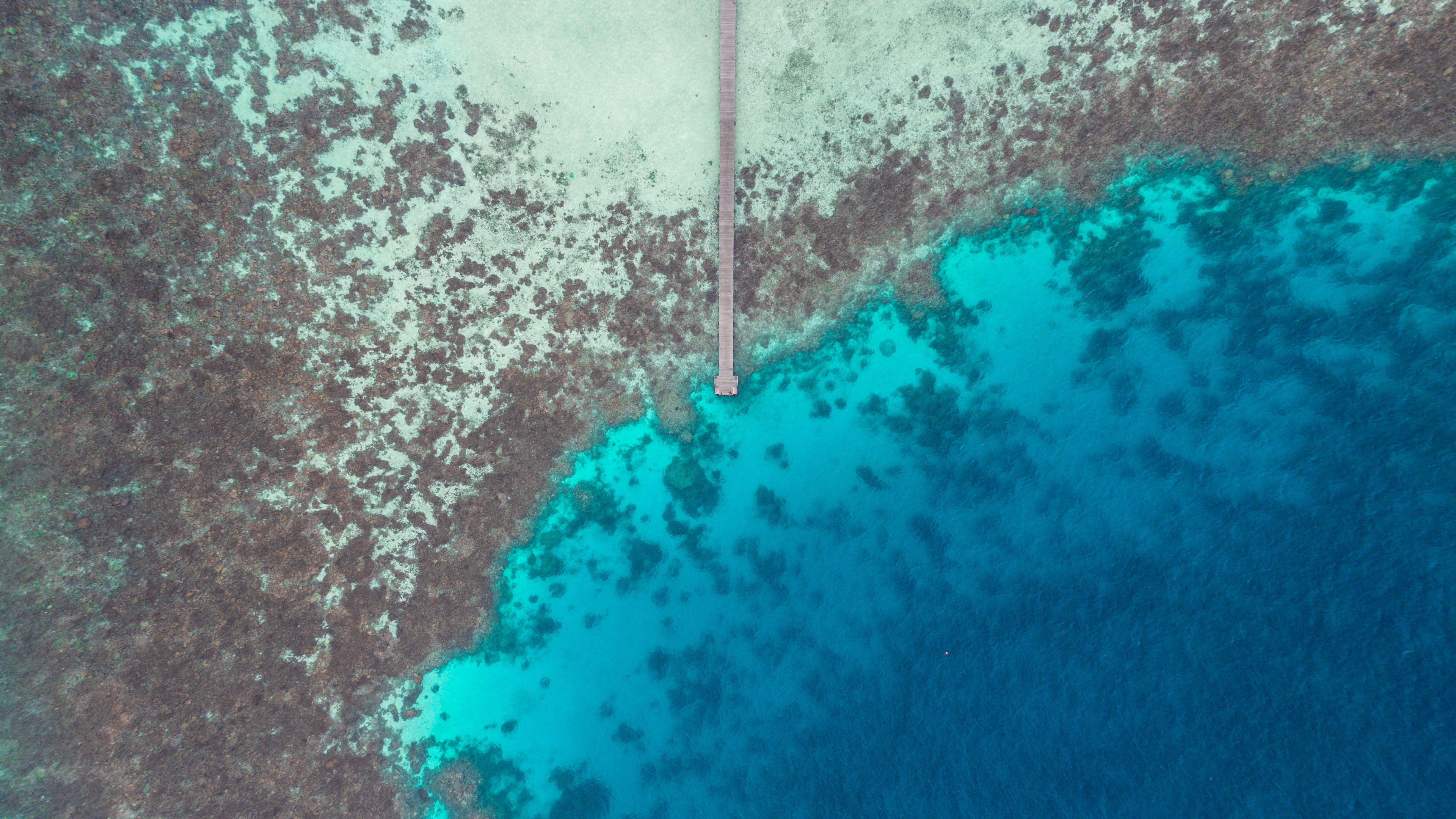 Aerial View of Ocean Pier Over Coral Reef