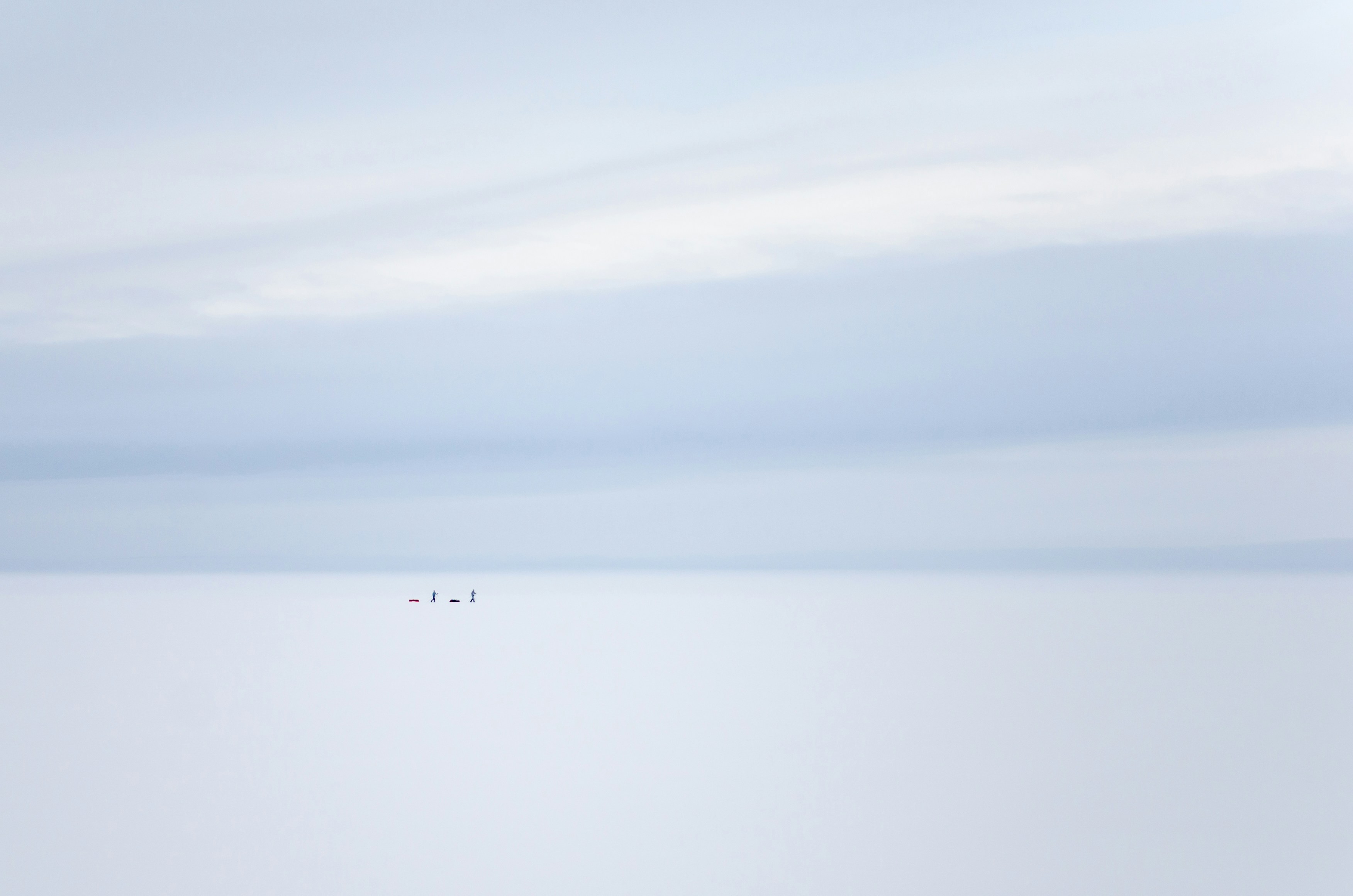 Tiny Figures on Vast Snowfield — Minimal Wallpapers