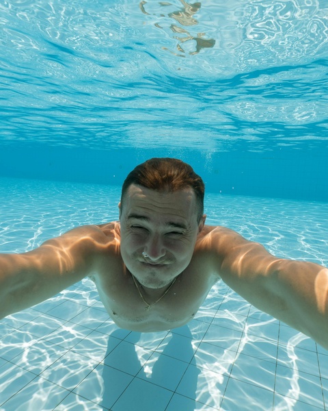 Man Taking Underwater Selfie in Pool