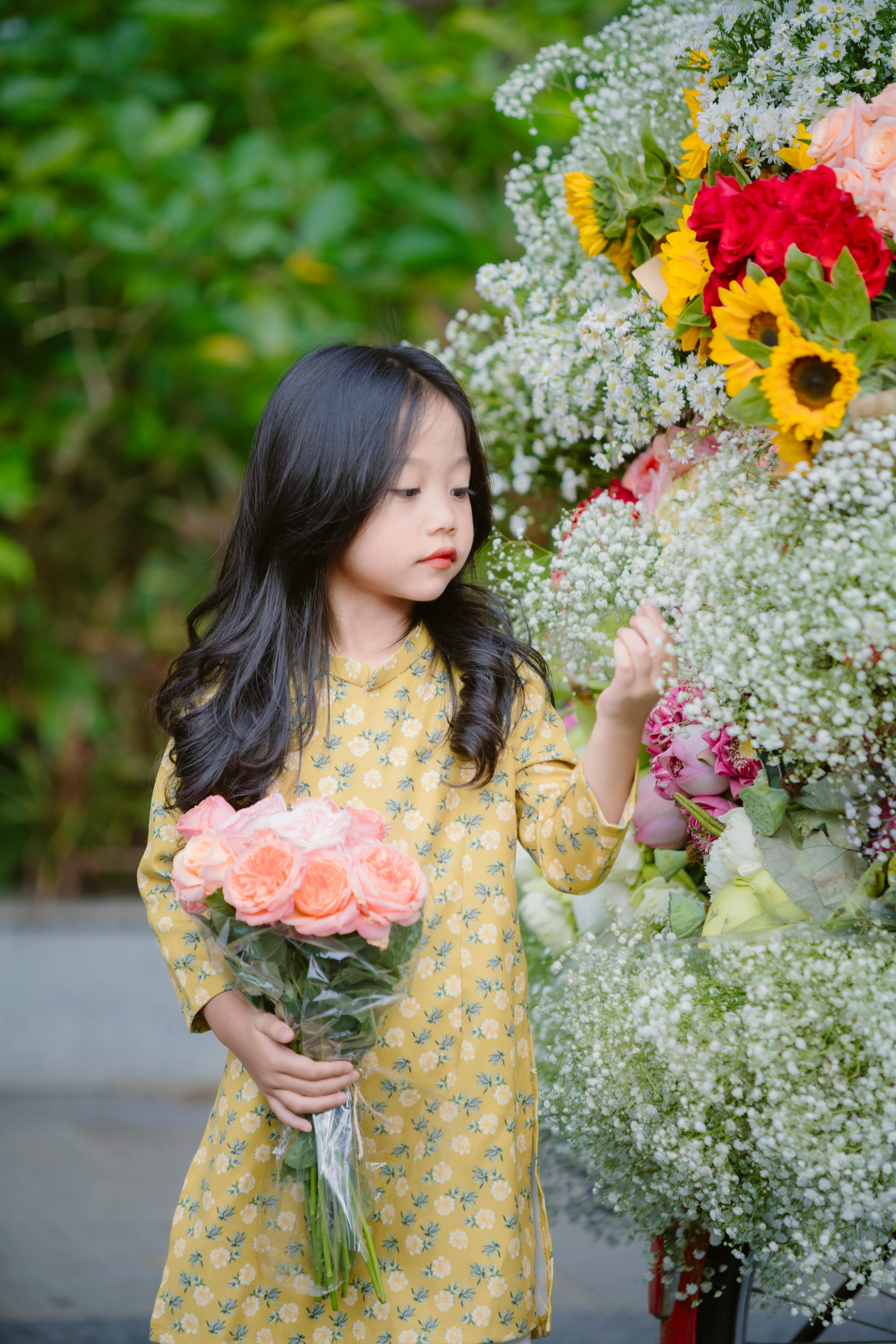 Young Girl Holding Flower Bouquet