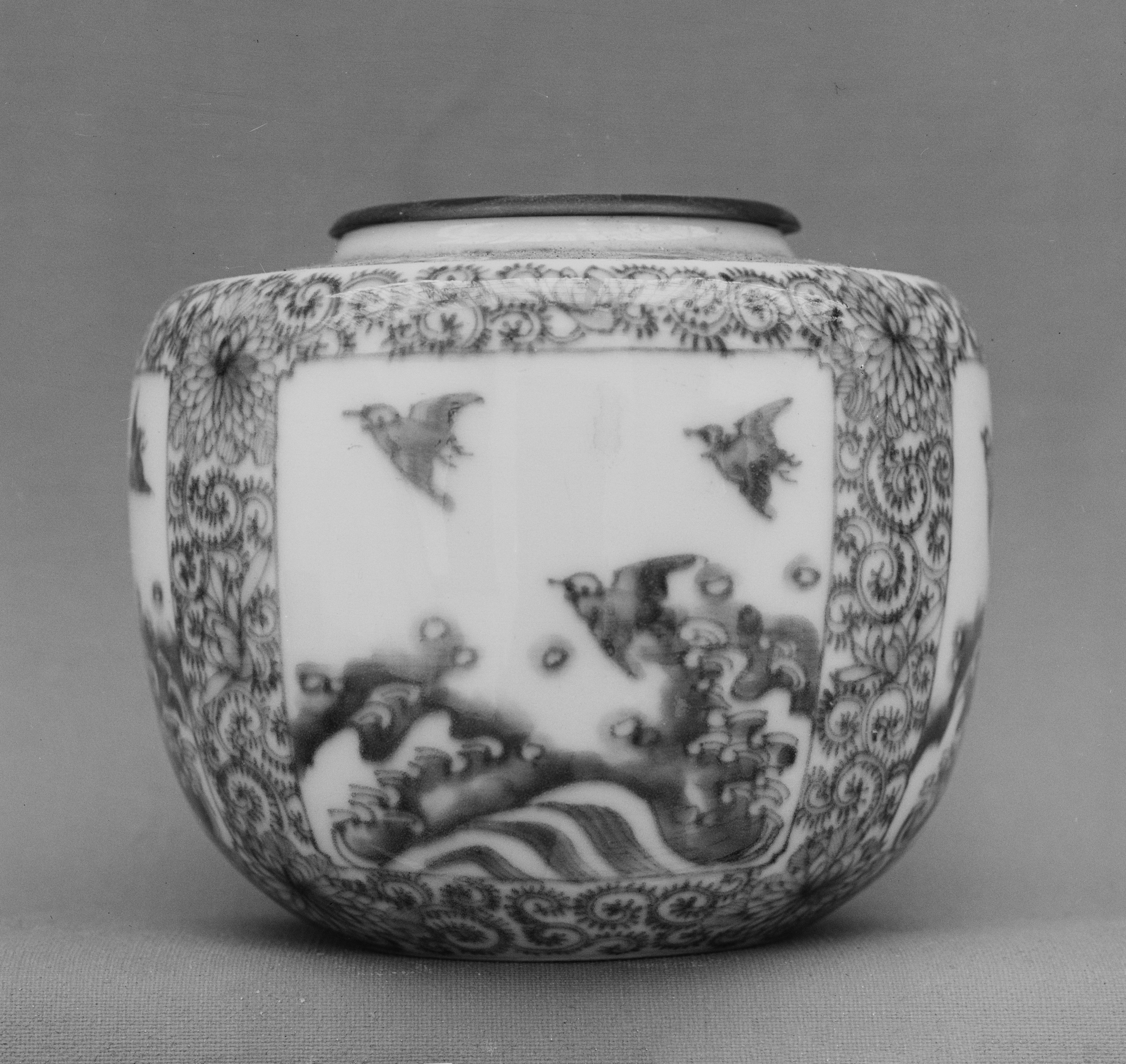 Grayscale Shot of Patterned Ancient Porcelain Jar