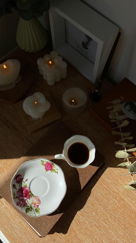 Cozy Coffee Corner with Lit Candles