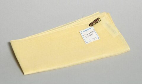 Folded Yellow Fabric with Price Tag