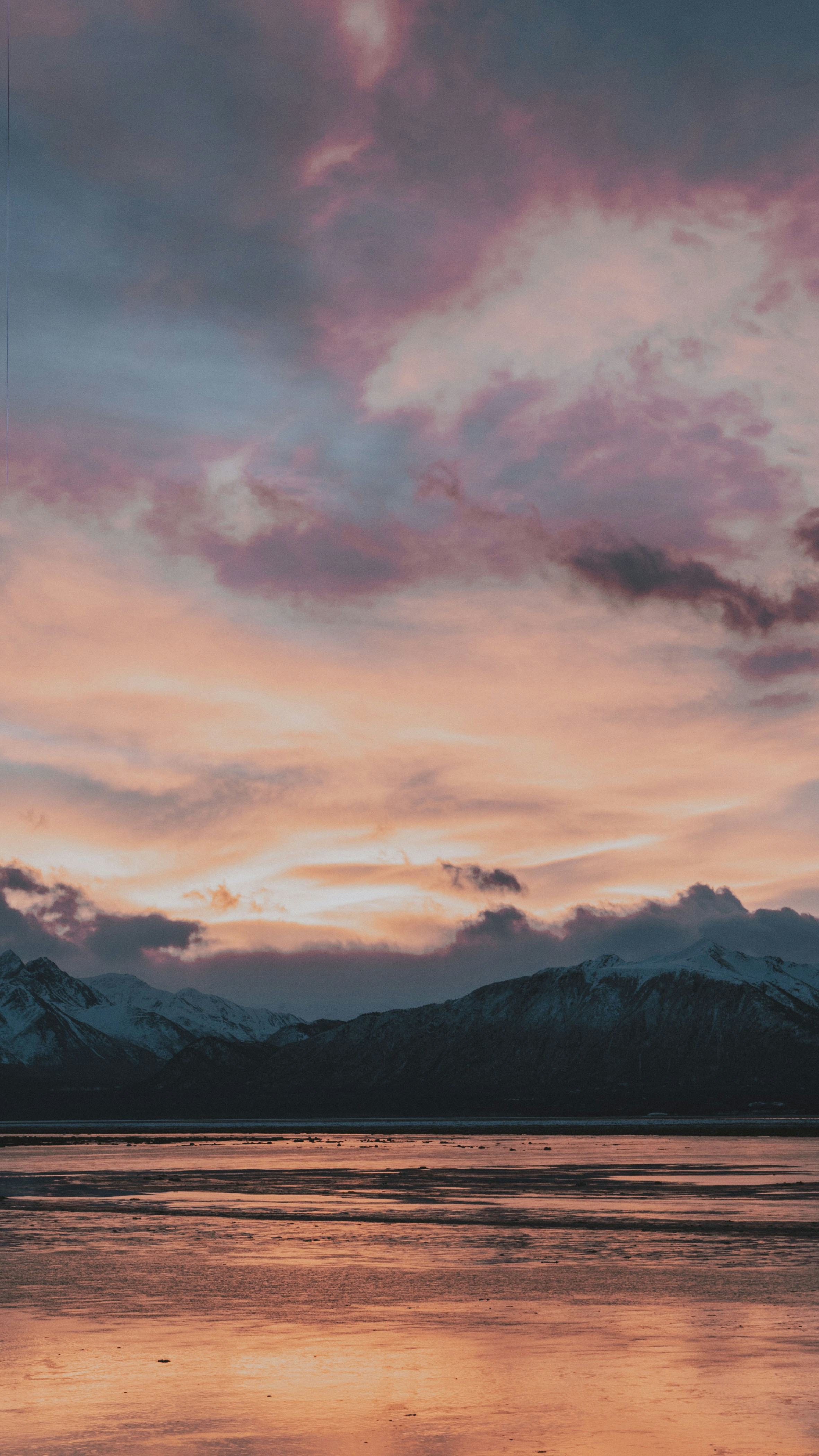 Sunset over Snow Mountains and Tidal Flat