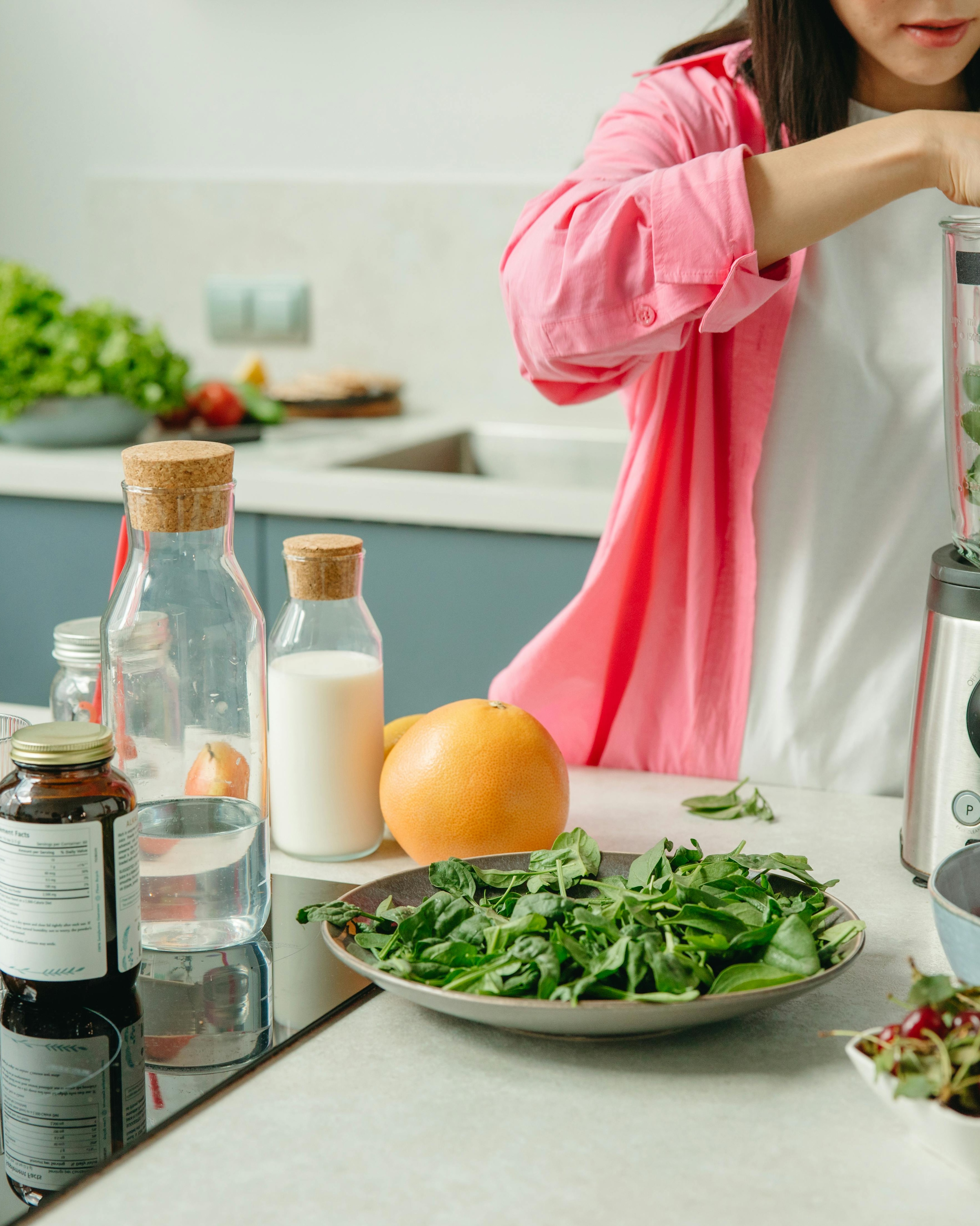 Woman Preparing Healthy Smoothie in Kitchen