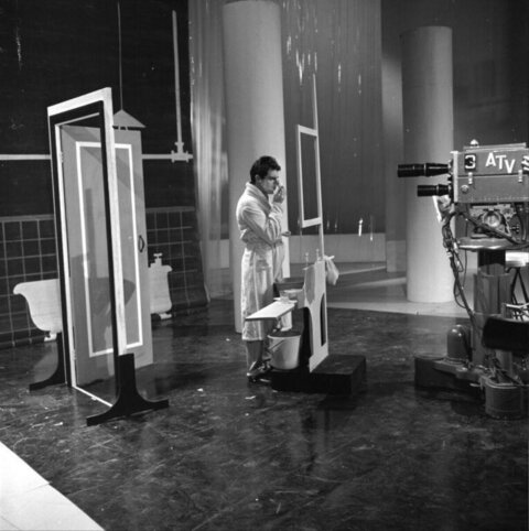 Actor Touching Up Makeup on TV Studio Set